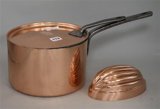 A copper saucepan and a jelly mould